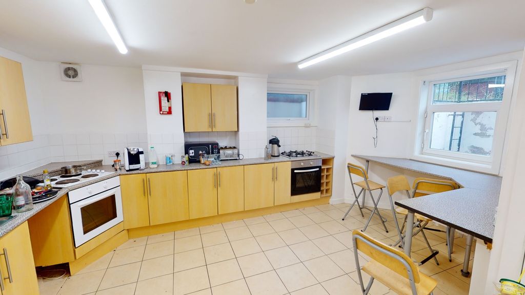 Property photo 1 of 7 Bright And Spacious Kitchen Featuring Ample Cabine...