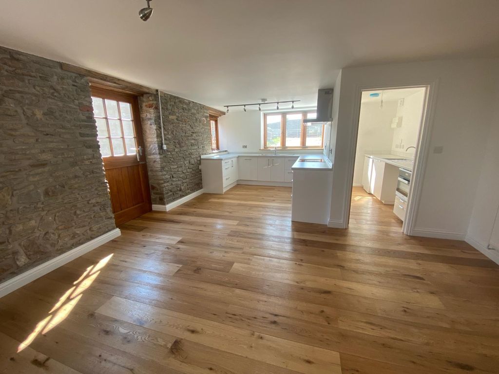 Property photo 3 of 17 Bright And Inviting Kitchen Space With Natural Lig...