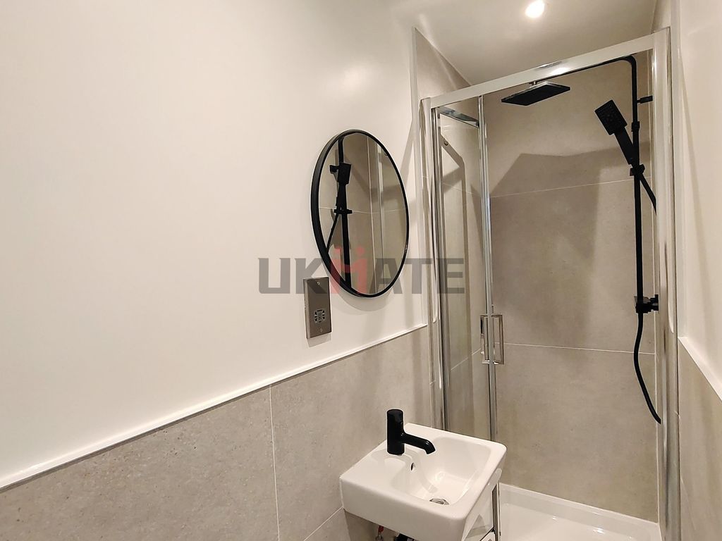Property photo 3 of 7 A Clean, Modern Bathroom Featuring A Walk-In Showe...