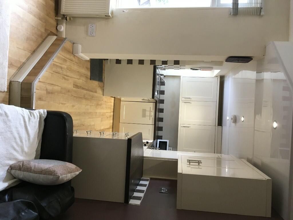 Property photo 3 of 14 A Modern Kitchen Featuring Clean White Cabinets, B...