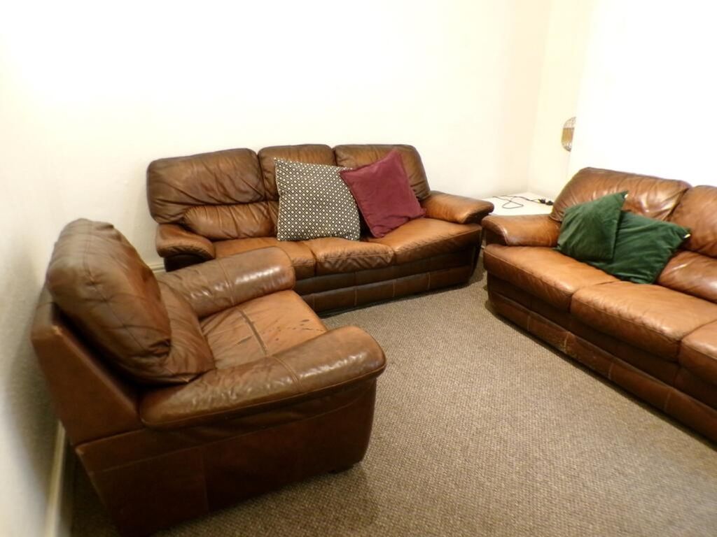 Property photo 1 of 9 A Cozy Living Room Featuring Comfortable Leather S...
