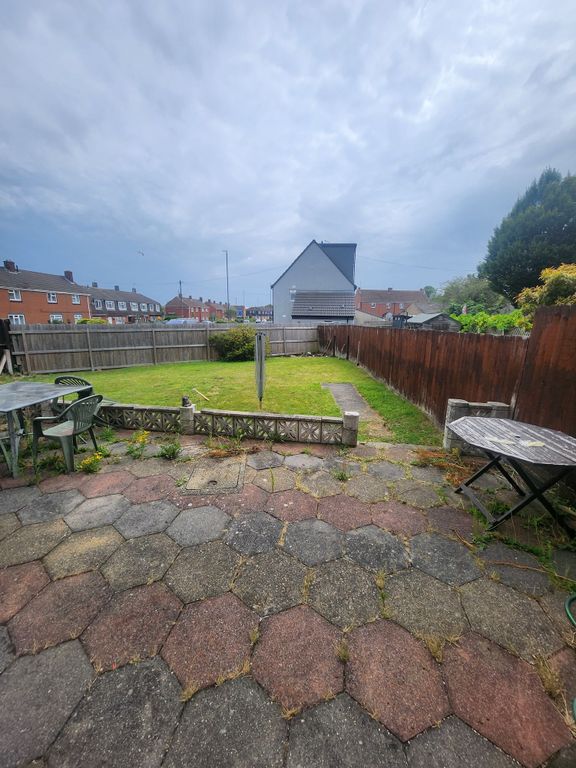 Property photo 3 of 12 A Spacious Garden Area Featuring A Paved Patio And...