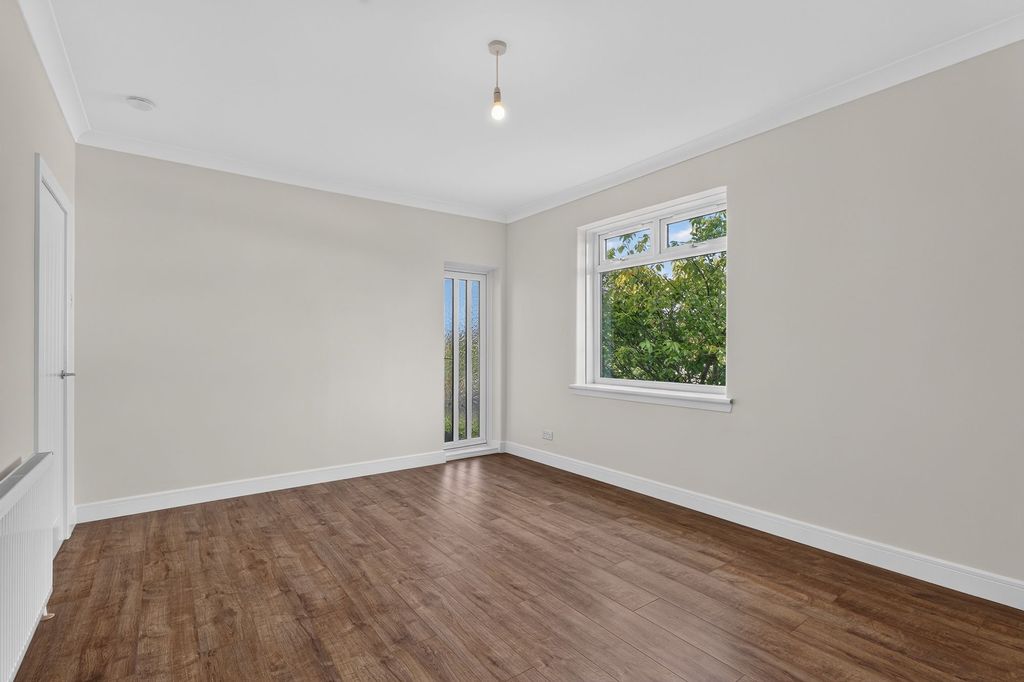 Property photo 2 of 26 Living Room And Balcony Door