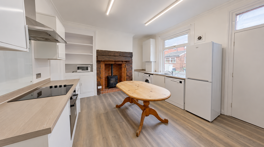 Property photo 2 of 10 Bright Modern Kitchen With Rustic Fireplace