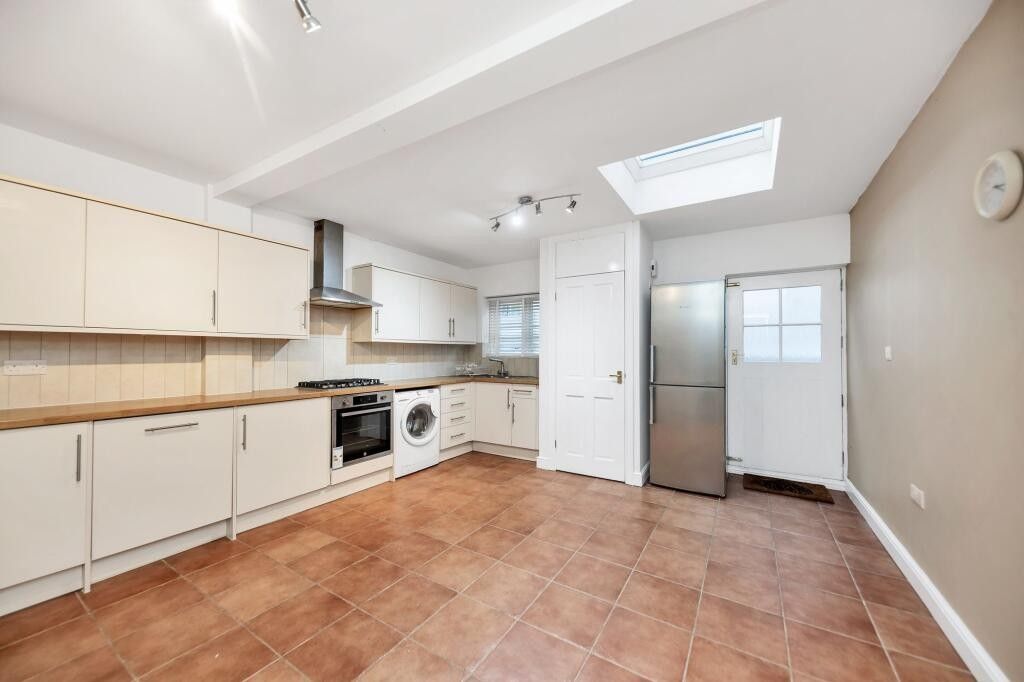 Property photo 3 of 6 Kitchen With Built In Cabinets And Back Door