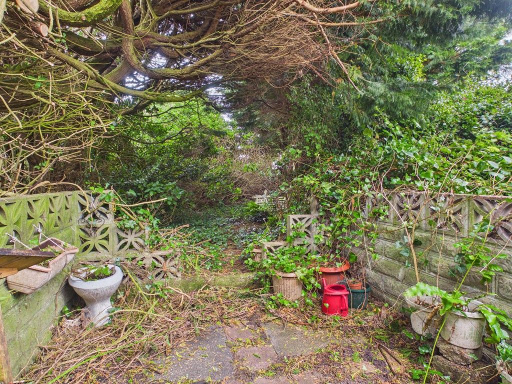 Property photo 2 of 8 Rear Patio Area Leading To Overgrown Garden
