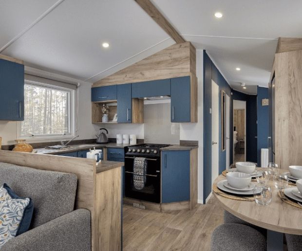 Property photo 3 of 5 Modern Blue Kitchen And Dining Area In The Willerby Ashford Holiday Caravan