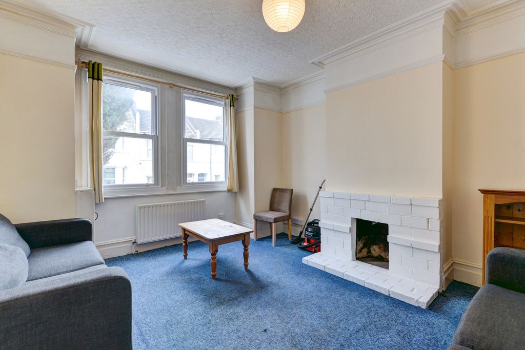 Property photo 2 of 16 A Spacious, Well-Lit Living Room With Large Window...
