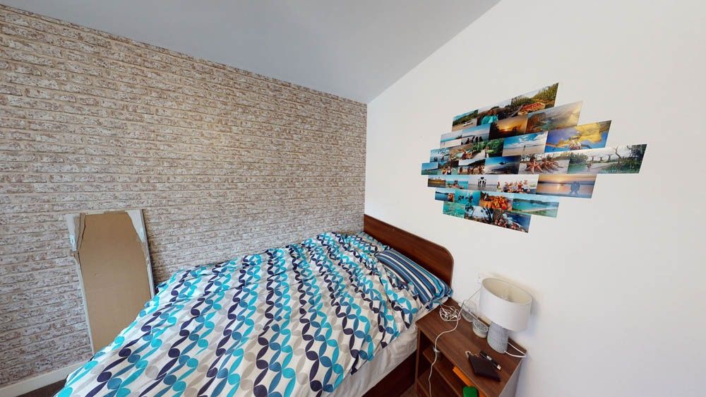 Property photo 1 of 8 A Cozy Bedroom Featuring A Double Bed With A Color...