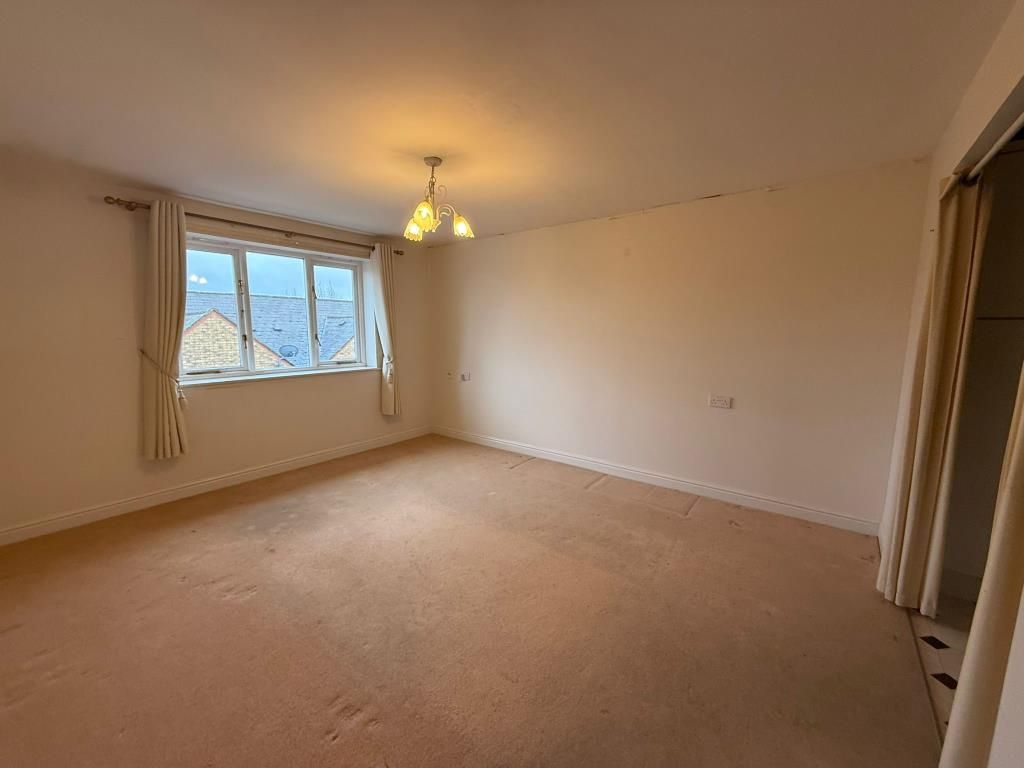 Property photo 2 of 9 Living Room With Window And Access Into Kitchen