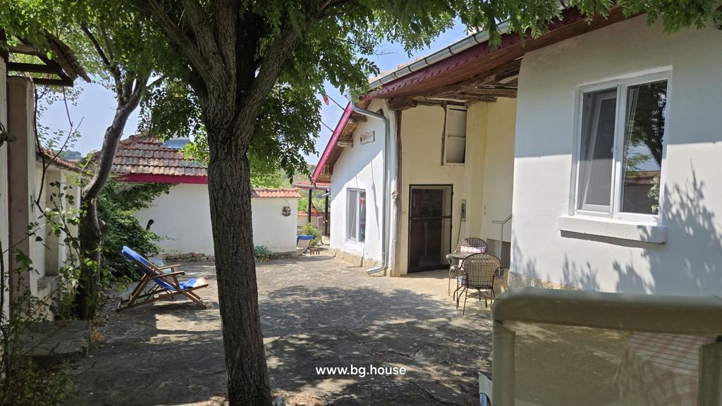 Property photo 2 of 100 View Of Courtyard Featuring A Tree, White Walls, Tiled Roof, And A Lounge Chair With Blue Towel.