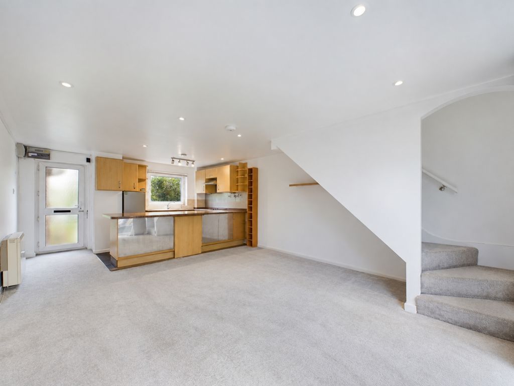 Property photo 3 of 8 Bright Empty Kitchen And Dining Room