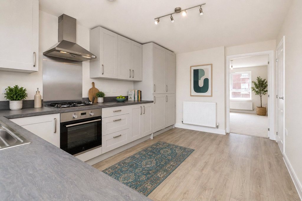 Property photo 3 of 7 Typical Kitchen