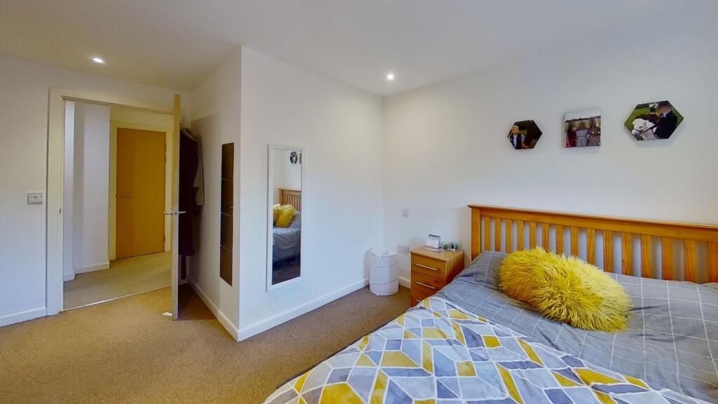 Property photo 1 of 7 A Bright And Tidy Master Bedroom Featuring A Woode...