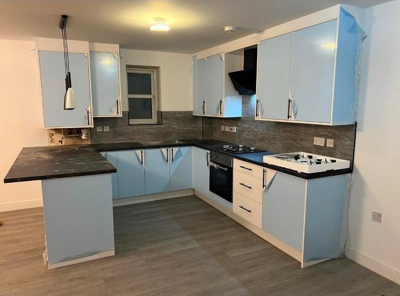 Property photo 1 of 6 Modern L-Shaped Kitchen With Pale Blue Cabinets, d...