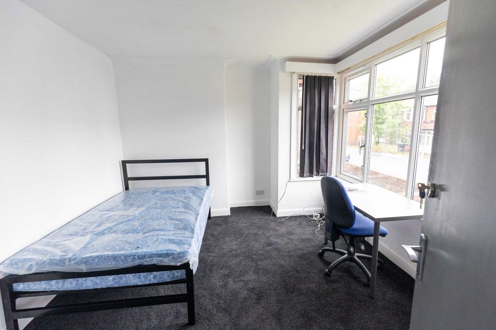 Property photo 2 of 9 A Bright, Simple Bedroom Featuring A Single Bed Wi...