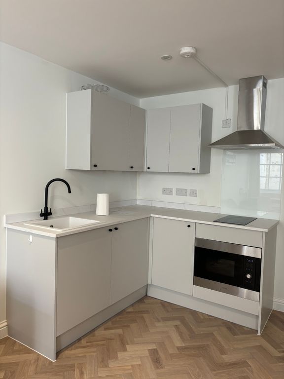 Property photo 2 of 4 A Modern And Tidy Kitchenette With Sleek Cabinetry...