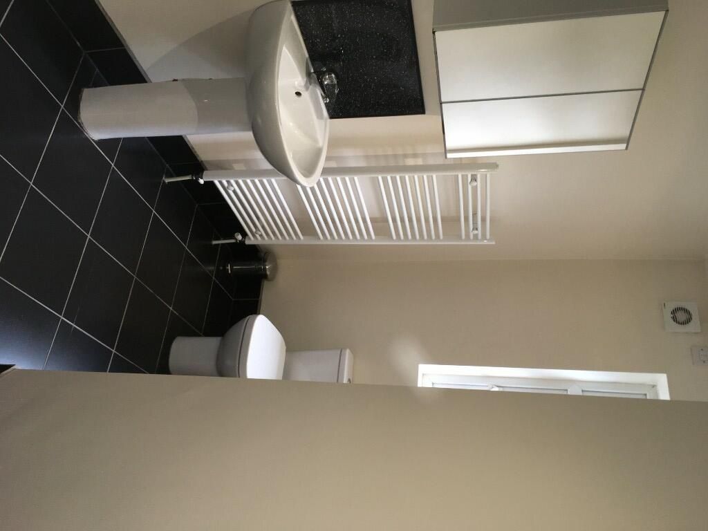 Property photo 1 of 14 A Modern Bathroom Suite Featuring A Clean White Si...