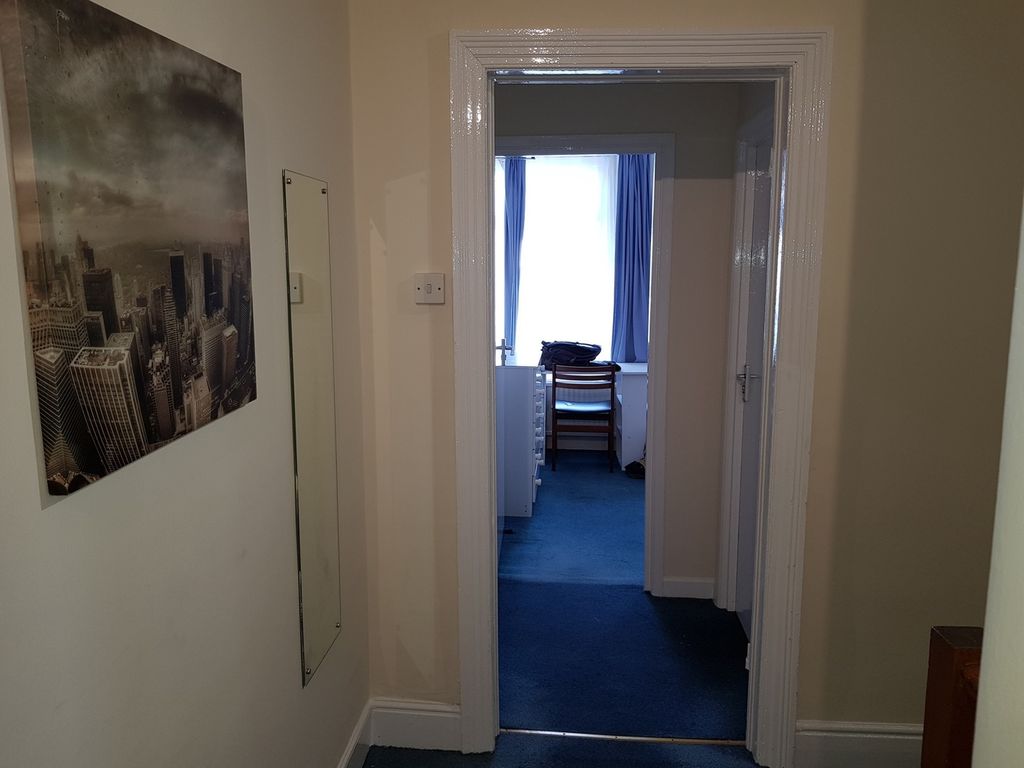 Property photo 2 of 16 A Welcoming Hallway Featuring A Cozy Carpet, With ...