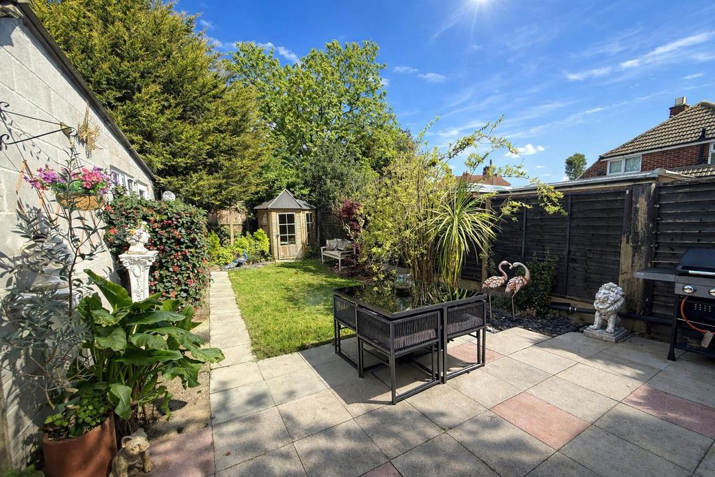 Property photo 3 of 18 Bright Backyard Garden On A Sunny Day.Png