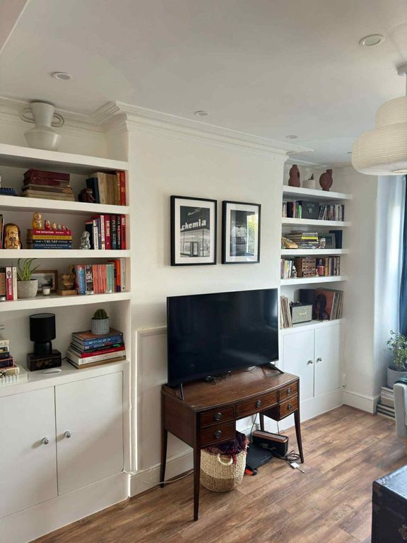 Property photo 2 of 3 A Bright And Inviting Living Room Featuring A Mode...