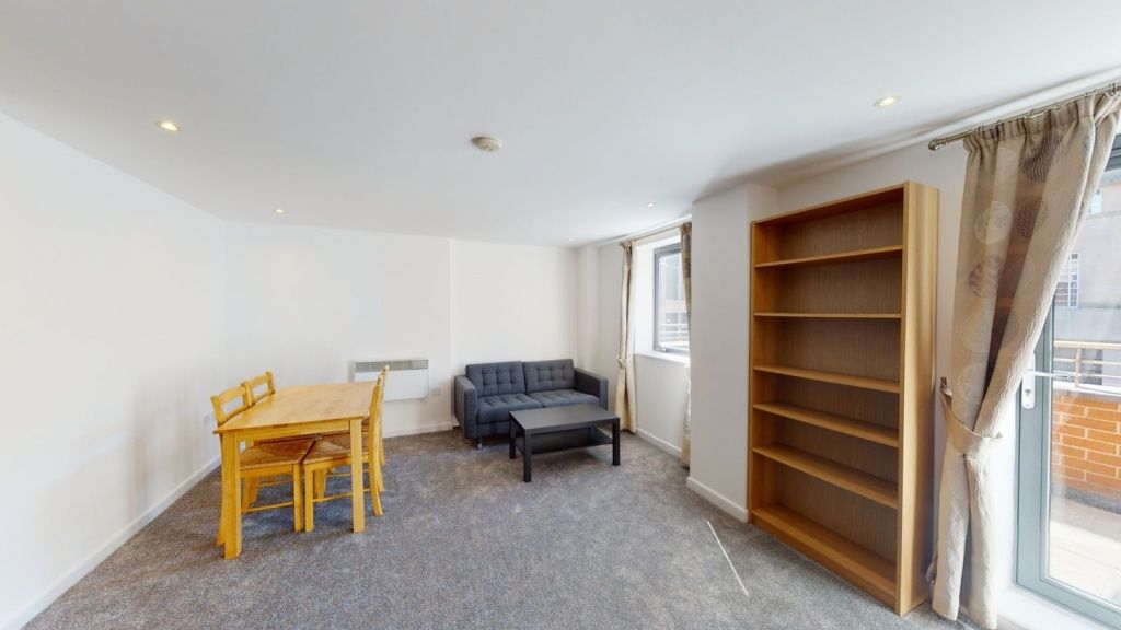 Property photo 3 of 5 Bright Living Room Featuring A Cozy Seating Area W...