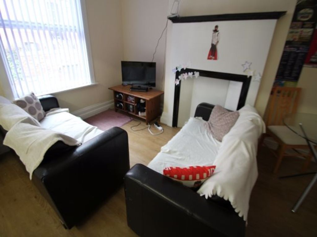 Property photo 3 of 16 A Cozy And Well-Maintained Living Room Featuring c...