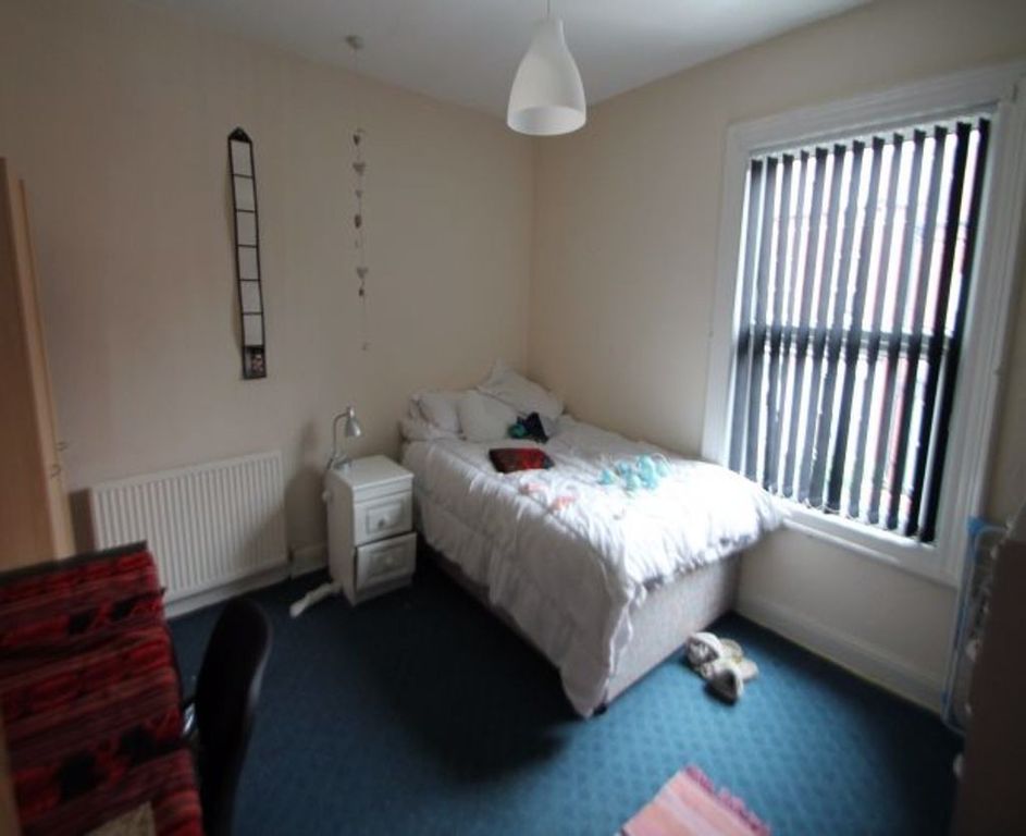 Property photo 3 of 13 A Bright And Cozy Bedroom Featuring A Comfortable ...