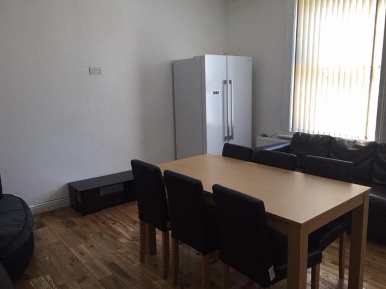 Property photo 3 of 16 Bright Furnished Living Area With A Dining Table A...