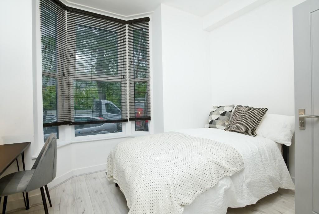 Property photo 1 of 12 A Bright, Inviting Master Bedroom With Large Windo...
