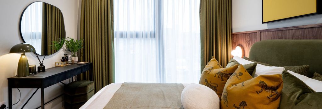 Property photo 2 of 4 Closeup Photo Of Double Bed And Window With Curtains, Moss-Green Design Palette, Vanity Table With