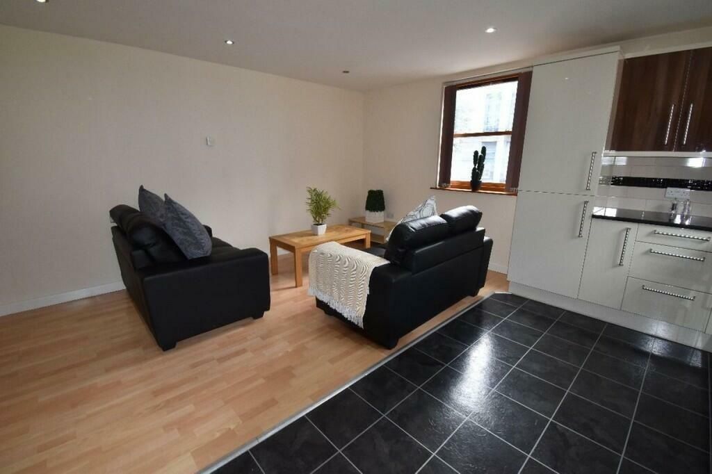 Property photo 3 of 8 A Modern, Open-Plan Living Room With Comfortable B...