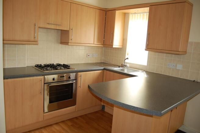 Property photo 3 of 7 Kitchen