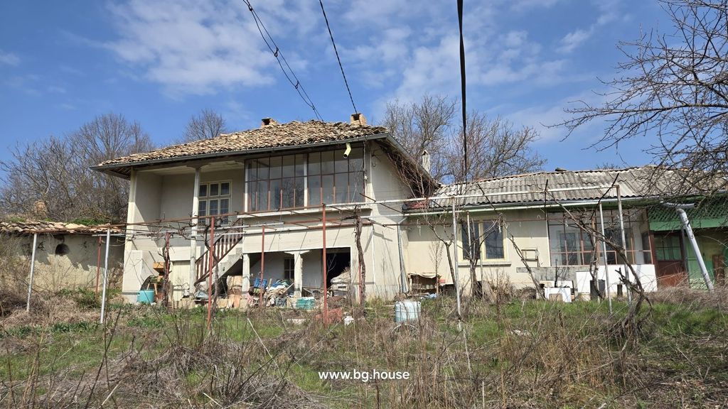 Property photo 1 of 52 View Of A Two-Storey Bulgarian House With A Tiled Roof, External Stairs, And A Garden Area With Dry Grass And Leafless Trees