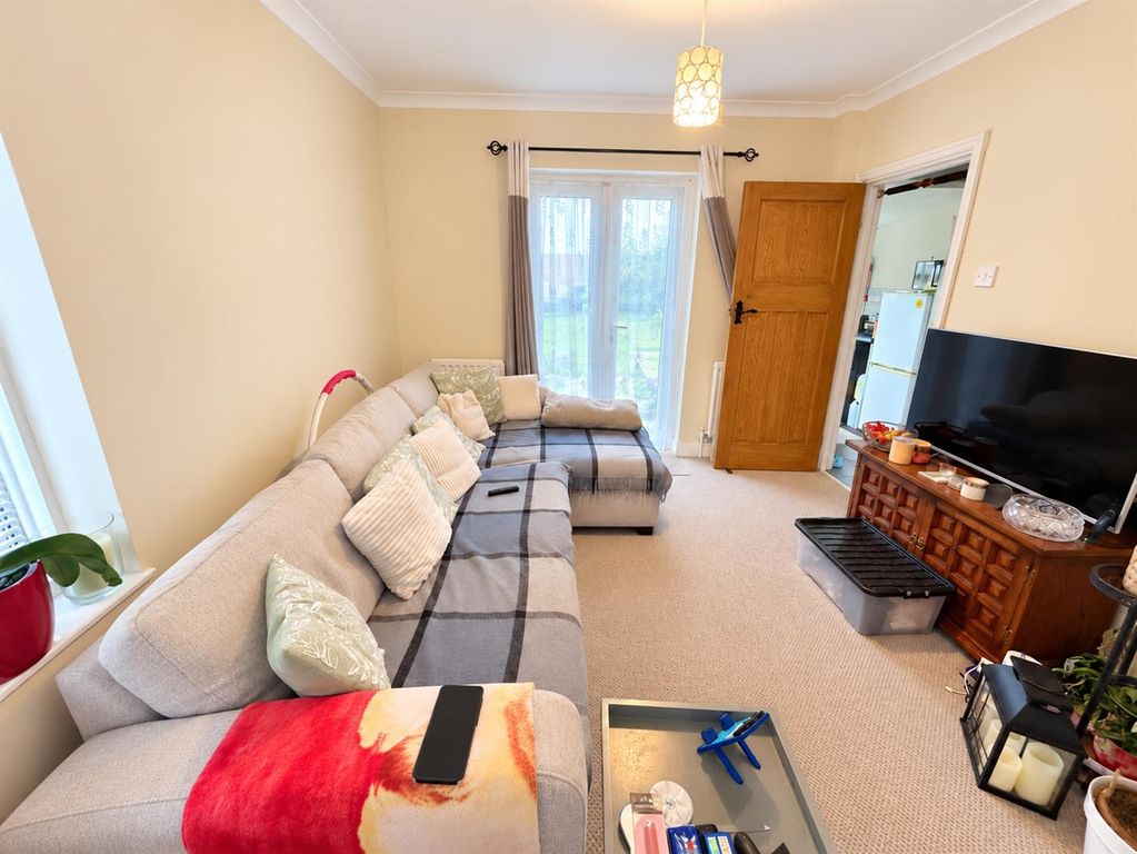 Property photo 2 of 12 Brightened Cosy Living Room Interior.Png