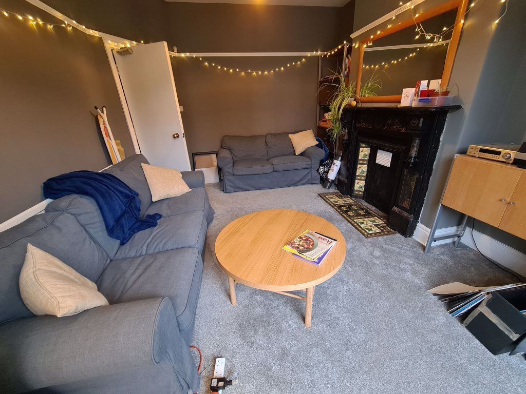 Property photo 2 of 19 A Modern, Well-Lit Living Room Featuring A Comfort...