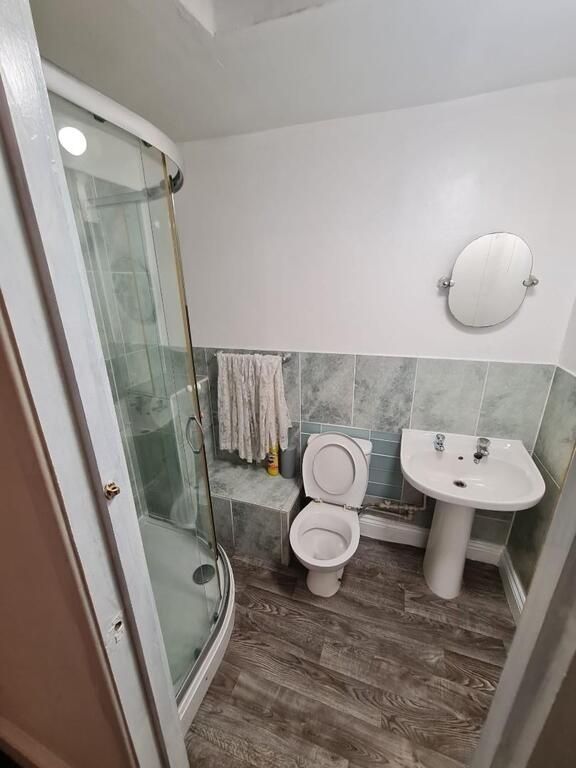Property photo 3 of 5 Clean, Modern Bathroom With A Curved Glass Shower ...