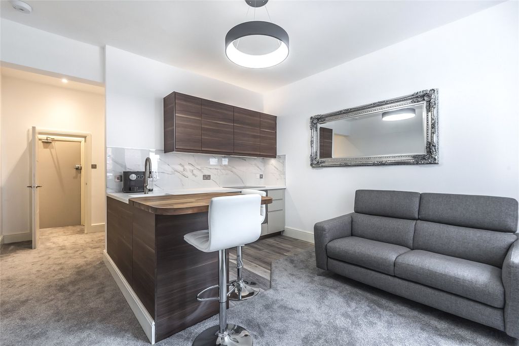 Property photo 1 of 9 Living Area