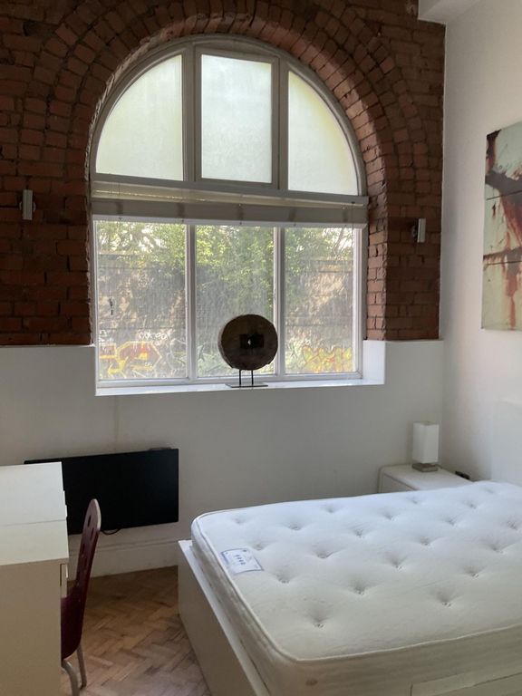 Property photo 3 of 11 Bright Double Bedroom Featuring A Large Arched Win...