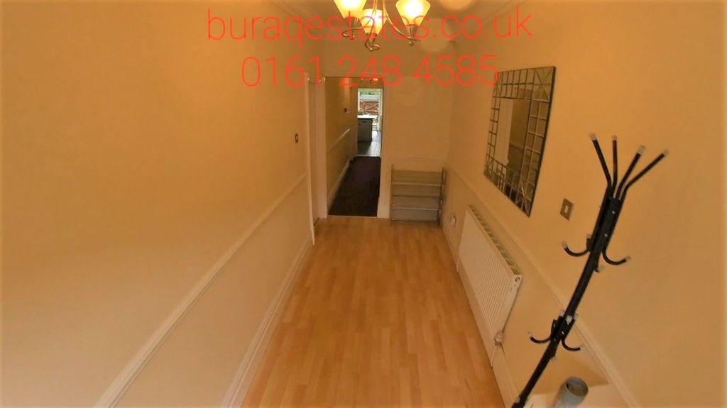 Property photo 2 of 15 A Clean And Well-Maintained Hallway Featuring Wood...