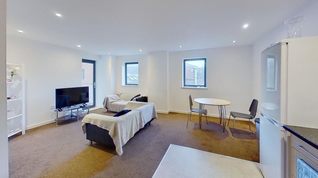 Property photo 2 of 7 Bright And Spacious Living Room Featuring Modern F...