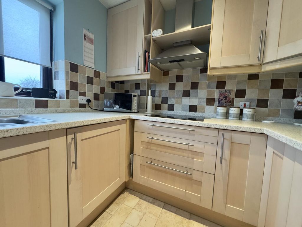 Property photo 3 of 12 Kitchen