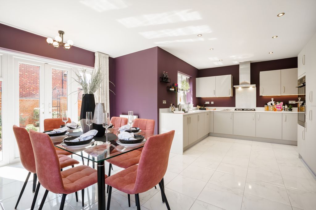 Property photo 2 of 10 A Glass-Top Dining Table With Coral Chairs Sits In The Foreground