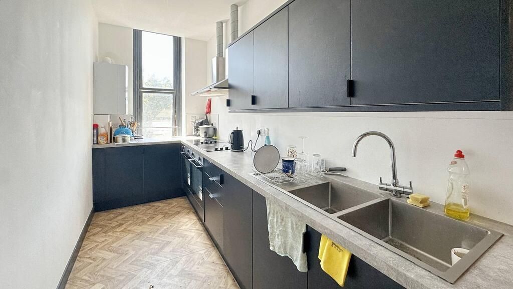 Property photo 2 of 6 Bright And Functional Kitchen With Ample Counter S...