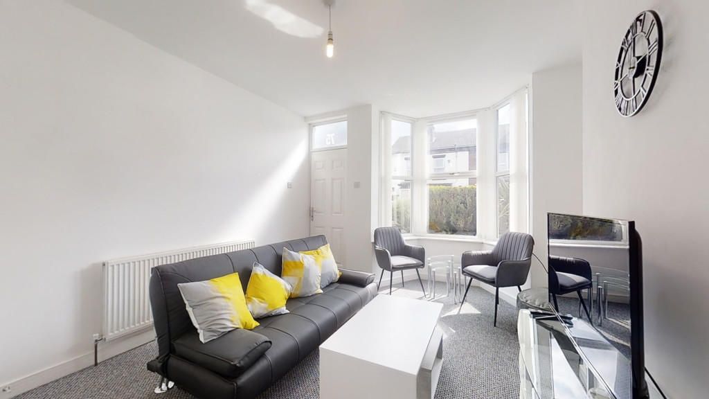 Property photo 2 of 10 Bright And Inviting Living Room Featuring A Comfor...
