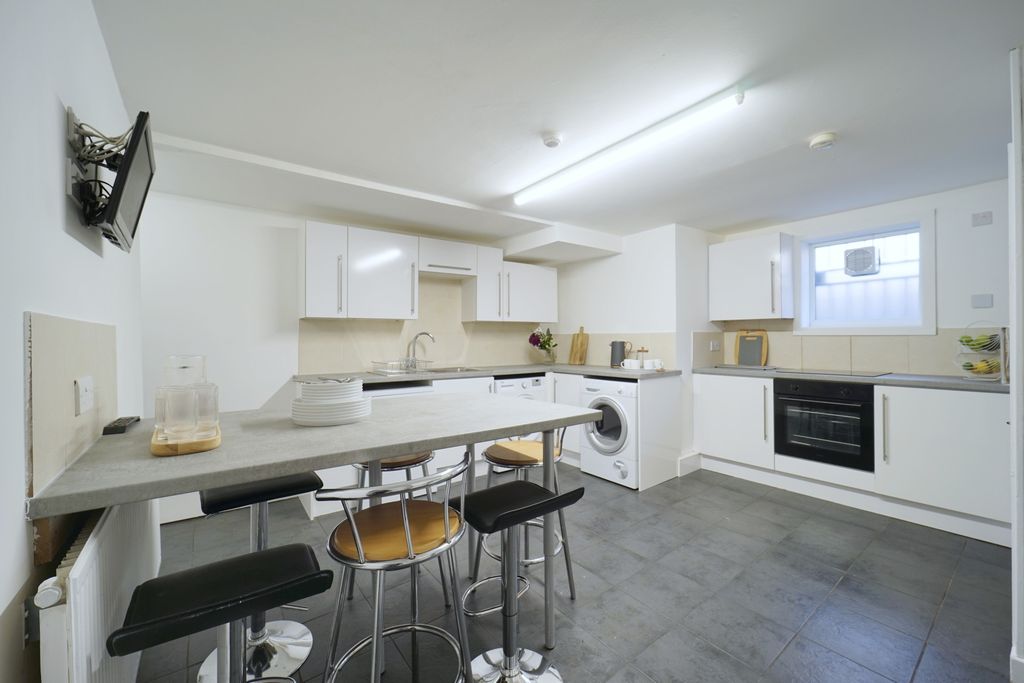 Property photo 3 of 31 Bright, Modern Kitchen With White Cabinetry, Integ...
