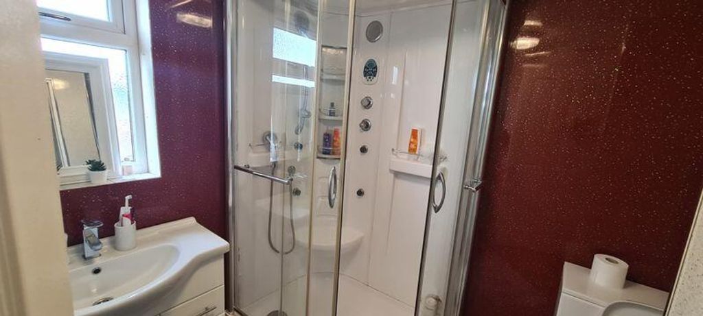 Property photo 1 of 10 A Modern Bathroom Featuring A Spacious Shower And ...