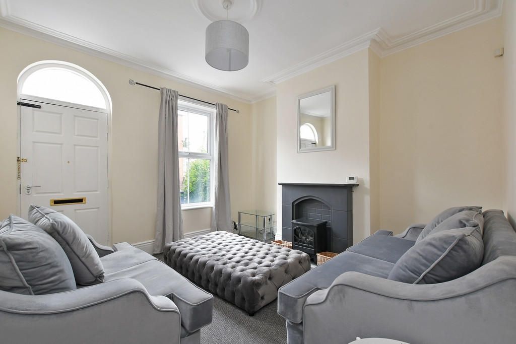 Property photo 3 of 10 A Bright And Cozy Living Room Featuring Two Comfor...