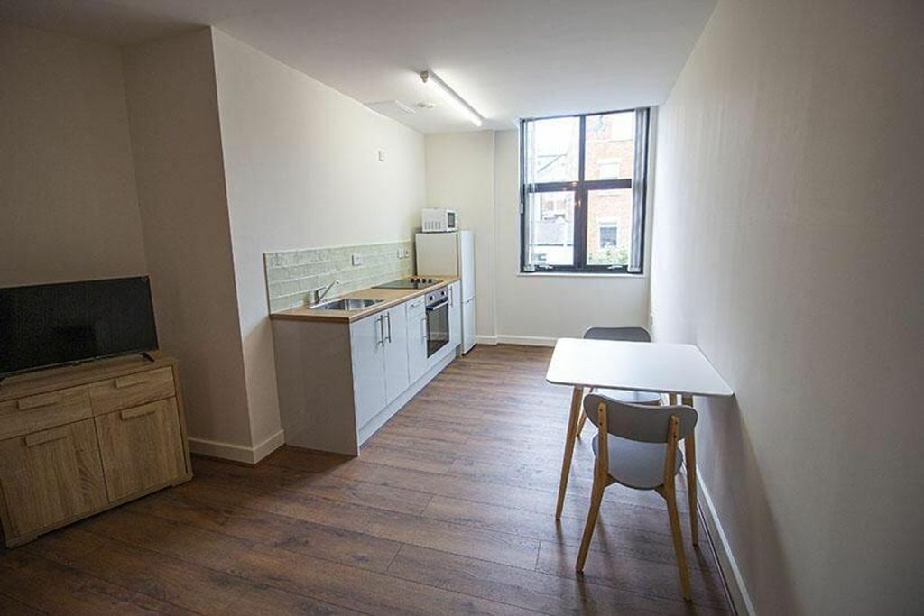Property photo 2 of 6 Modern Kitchen Area Featuring Ample Counter Space ...