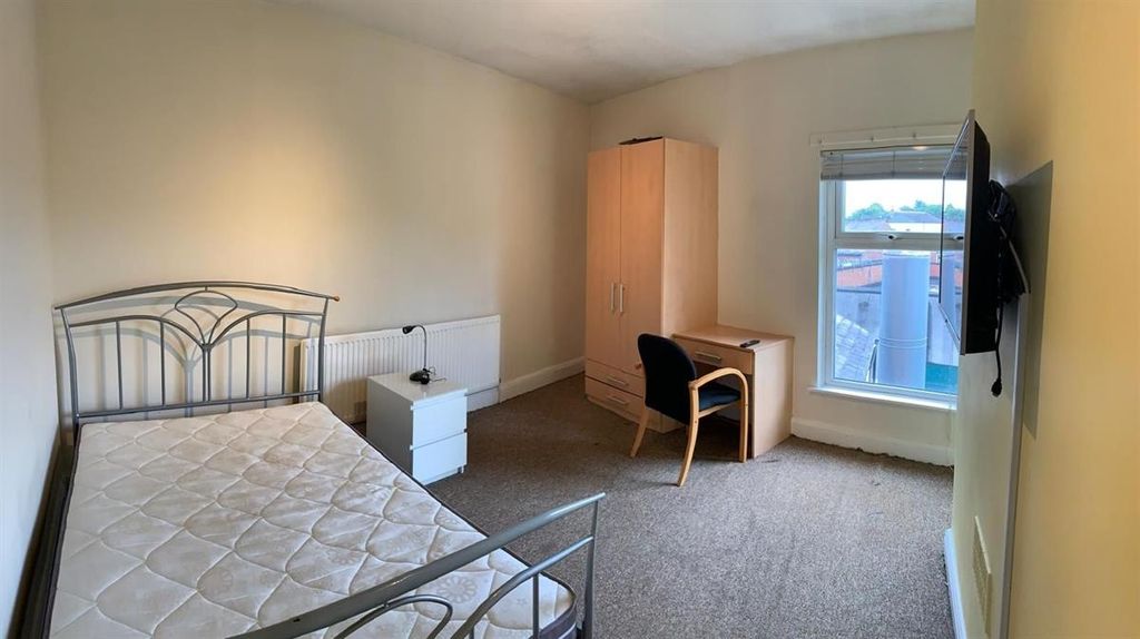 Property photo 3 of 9 Bright, Simply Furnished Bedroom With A Metal Bed ...